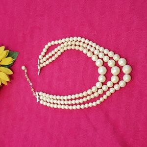 Vintage triple strand of pearls stamped "Japan"